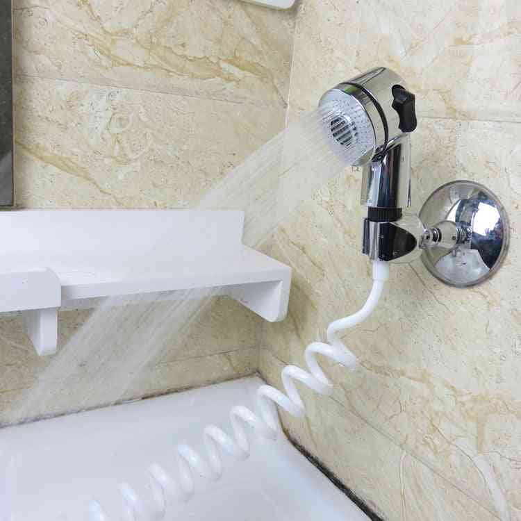 Csaptelep zuhanyfej - a permet lefolyja a szűrőtömlő mosogatóját
