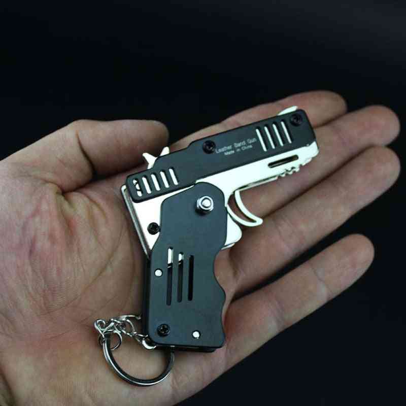 Alle metalen mini kan worden opgevouwen als een sleutelhanger rubberen band pistool speelgoed