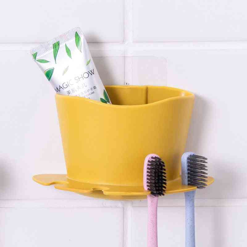 Tandbørste og tandpasta i plast- holder til opbevaring
