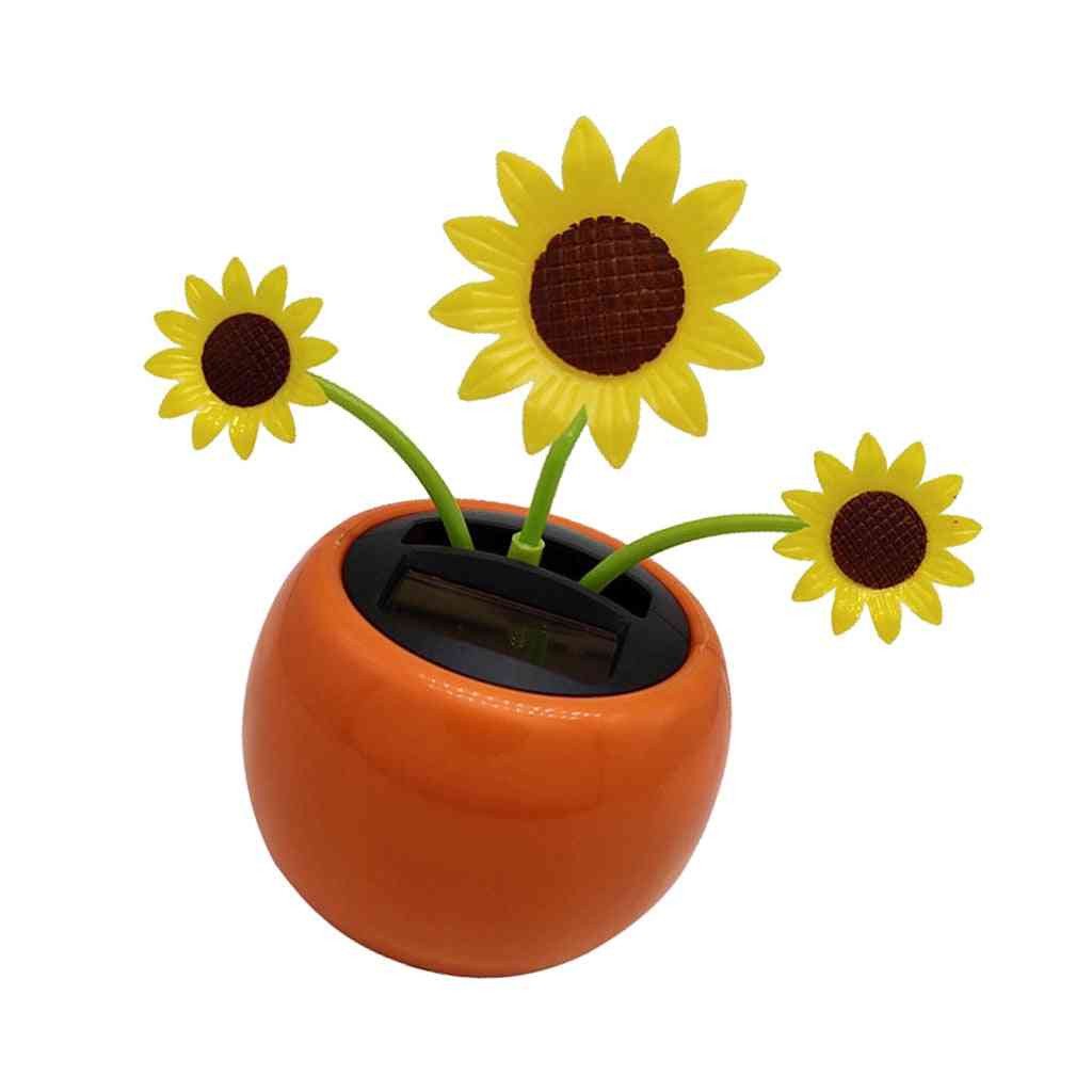 Fiore del sole danzante a energia solare - ornamento di girasole per il cruscotto dell'auto dell'ufficio.